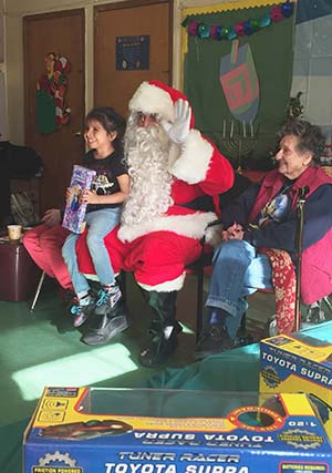 Santa Claus brings Christmas cheer to AHRC school St Francis De Paola via Greenway Products & Services
